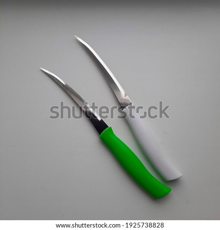 two kitchen knives on a white background