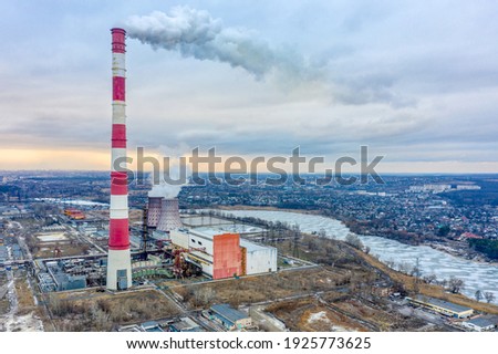 High chimney of a large thermal power plant. View from above. A lot of smoke from the chimney.