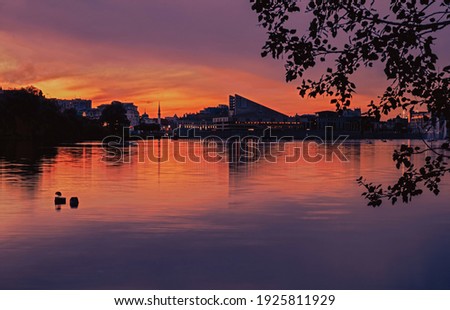 Kaban lake in front of Kamal Theatre in Kazan. Popular attraction of the city. Sunset cityscape.