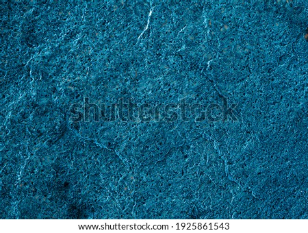 Dark blue aged textured wall. Background photo
