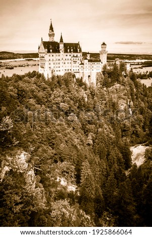 colorless antique photo of neuschwanstein, famous medieval castle of knights, dragons and princesses, castle