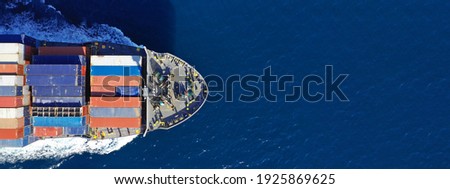 Aerial drone ultra wide photo of colourful truck size container tanker ship cruising deep blue sea near commercial port of Piraeus, Attica, Greece Royalty-Free Stock Photo #1925869625