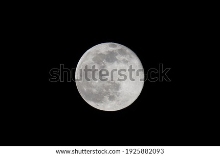 Moon shining in the night sky