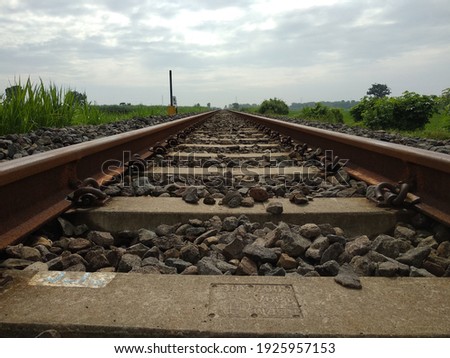 a collection of small stones on the railroad tracks
