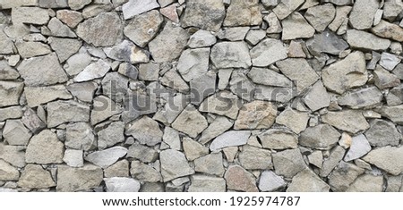 a beatiful and vintage stone wall that gives such an awe-inspiring view of lovely nature Royalty-Free Stock Photo #1925974787