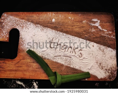 Word in flour with rustic background 