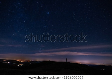 View of the Feldberg tower in the Black Forest in Germany and the starry sky shot in November 2019