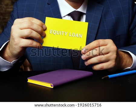 Business concept meaning EQUITY LOAN with sign on the sheet. Home equity loans allow homeowners to borrow against the equity in their residence
