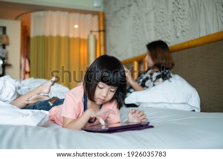 chinese child addicted phone, asian girl playing smartphone, kid watching cartoon
