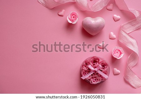Natural spa set with bath salt and soap rosebuds on a pink background. Valentine's Day, birthday, mother's day, 8 March. Top view, flat lay. Royalty-Free Stock Photo #1926050831