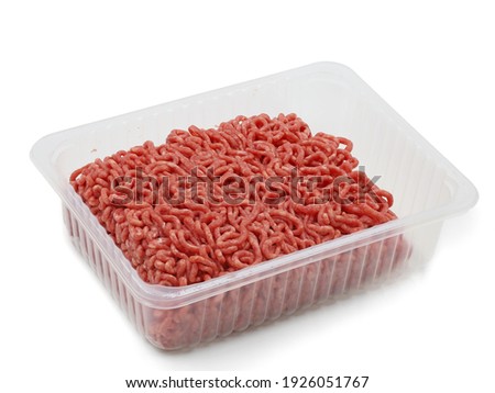 raw fresh beef minced meat in plastic container on white background.