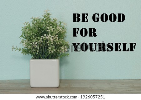 flower isolated at wall with motivational qoutes. Be good for yourself.