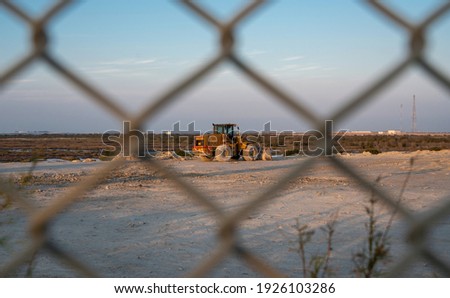 View through the fence over a construction site. selective focus