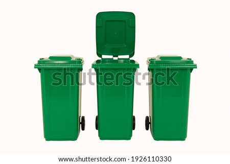 Set of three new unbox green large bins isolated on white background. Royalty-Free Stock Photo #1926110330