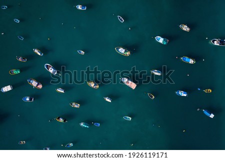 Aerial top view of fishing boats in the sea. 