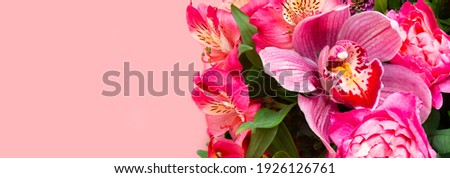 Flower arrangement, Phalaenopsis orchid among flowers on a pink background, banner, holiday card, greeting card blank