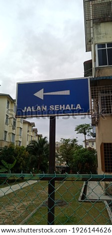 Sign board in Malay means it is a one way road.