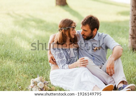 Eclectic wedding couple in the park together