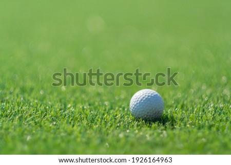 Golf balls on artificial grass with blur background