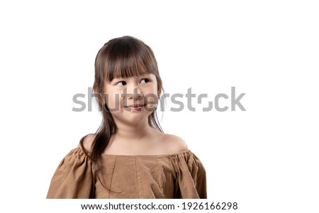 Portrait of smiling young happy asian girl, looking up thinking looking for clues or idea isolated on white background with clipping path.