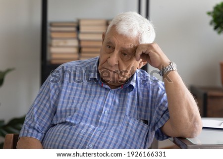 Head shot unhappy pensive mature man lost in thoughts, looking to aside, grieving, sad upset senior male thinking about health problems, feeling lonely and depressed, elderly and solitude concept Royalty-Free Stock Photo #1926166331