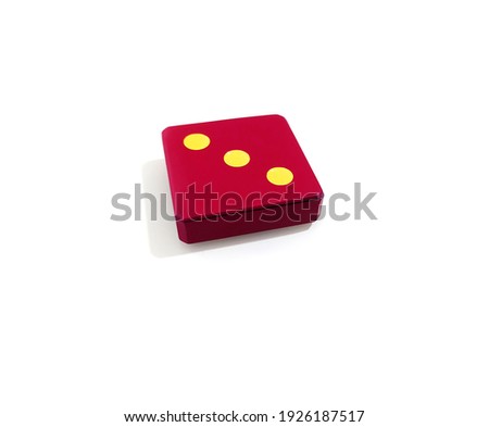 Bright red domino cube with the number three
