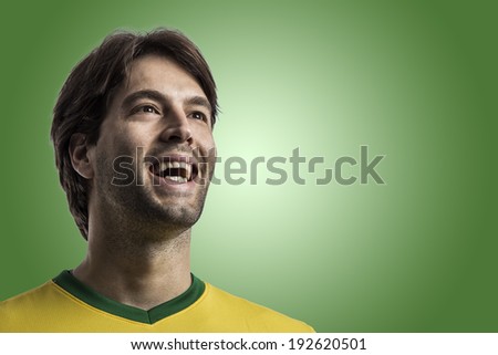Brazilian soccer player, celebrating on a green background.