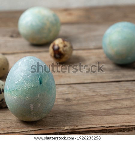 Easter eggs on rustic wooden background. Happy Easter greeting card template