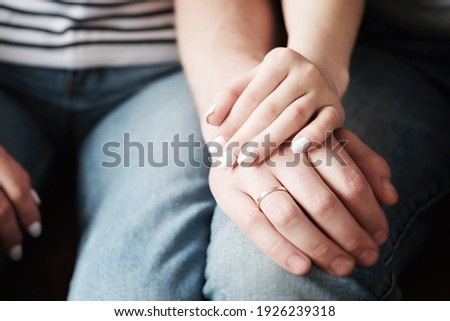 Hands of a man and a woman close up - Affectionate relationship between husband and wife Royalty-Free Stock Photo #1926239318