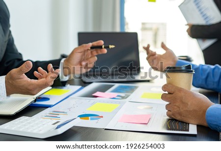 Meeting concept Business team hands at working with financial plan, meeting, discussion, brainstorm with tablet on the office desk, 