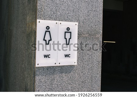 Public toilet. Signboard with the inscription male and female toilet. Toilet signage and toilet warning signs.