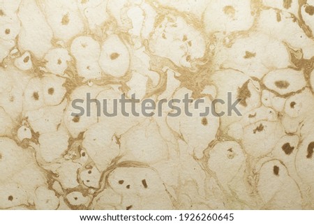 Beautiful golden yellow color handmade paper of marble texture with veins and fibers. Useful for background, 3d rendering.