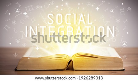Open book with SOCIAL INTEGRATION inscription, social media concept