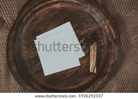White blank cards in boho interior in brown tones