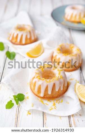 Tangy mini lemon bundt cakes topped with lemon glaze