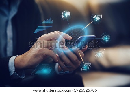 Businessman investor analyzing company financial mutual fund report working with digital augmented reality graphics technology. Concept for business, economy and marketing. Royalty-Free Stock Photo #1926325706