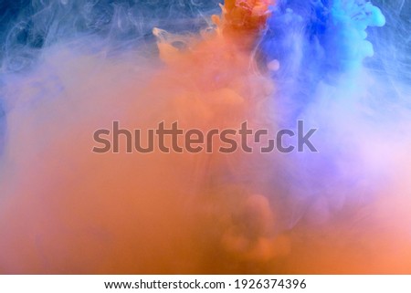 Fluid art. Blue-orange abstract background of flowing fluid.