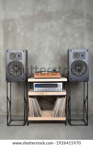 HiFi system with turntable, amplifier, headphones and lp vinyl records in a listening room Royalty-Free Stock Photo #1926415970