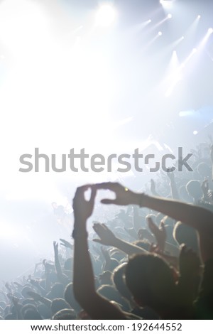 Raised hands in a rock concert