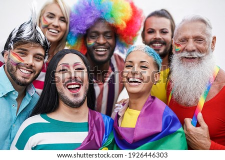 Multiracial gay people having fun at pride parade - Concept of lgbt and homosexual or transexual love Royalty-Free Stock Photo #1926446303