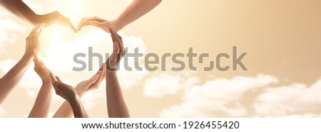 Symbol and shape of heart created from hands.The concept of unity, cooperation, partnership, teamwork and charity. Royalty-Free Stock Photo #1926455420