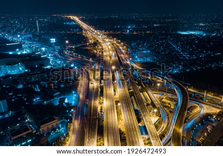 Expressway top view, Road traffic an important infrastructure in Thailand. Road and Roundabout, multilevel junction motorway, U turn road Royalty-Free Stock Photo #1926472493