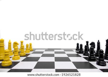 Chess pieces in white background with yellow and black color, chess concept