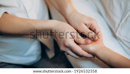 Close up photo of a caucasian woman at the spa salon having a hand massage session