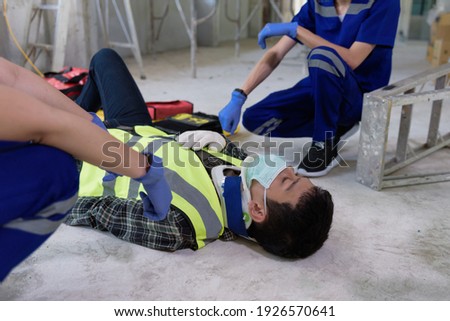 First aid for head injuries and Considered for all trauma incidents of worker in work, Loss of feeling or loss of normal movement and Loss of function in limbs, First aid training to transfer patient. Royalty-Free Stock Photo #1926570641