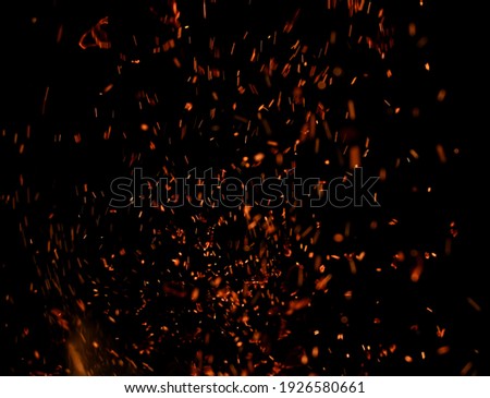 sparks of fire on black background
