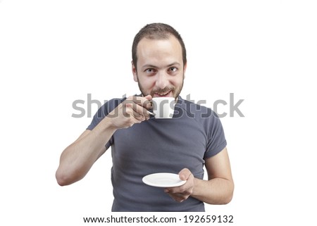 young man drinking a cup of coffee or tea isolated white background