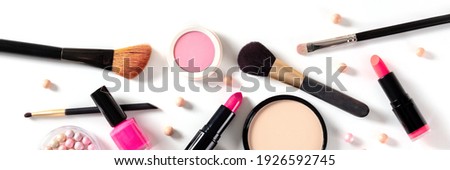 Makeup panorama, overhead flat lay shot with brushes, pearls and other products on a white background