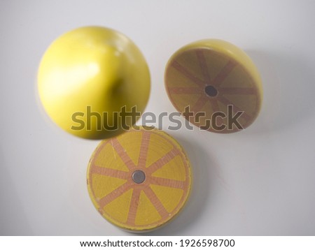 Floating slices of wooden lemon toy
