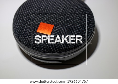 Black speaker on white background. Speaker write.
